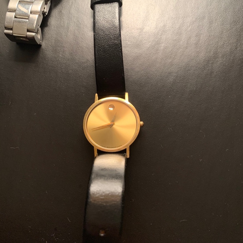 Movado gold faced watch with black leather strap